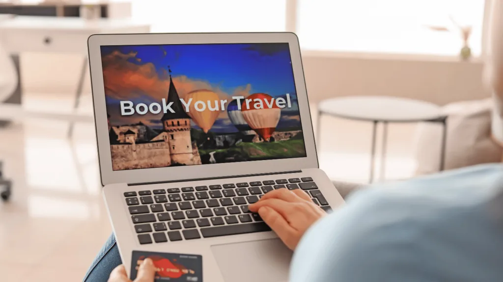 Traveler booking a flight from computer and hoping for good customer service