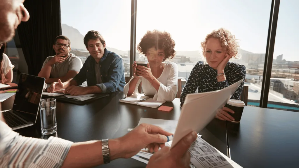 Business executives talking about call center outsourcing as a strategic move