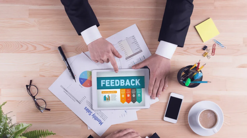 SaaS customer support team working together to handle customer feedback and check customer feedback