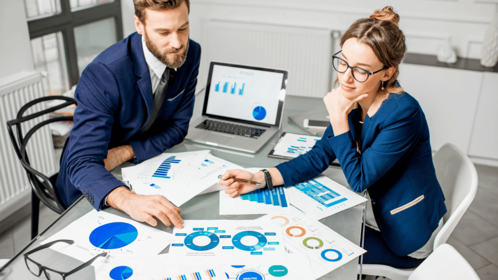 A customer support team looking at data and graphs about customer queries