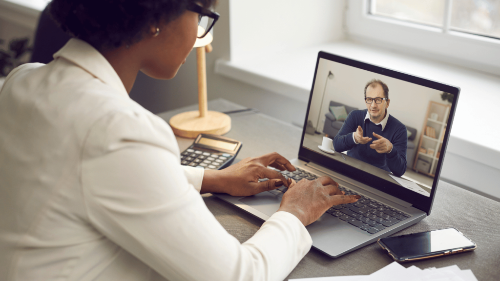 Executive assistant talking with a boss via virtual call